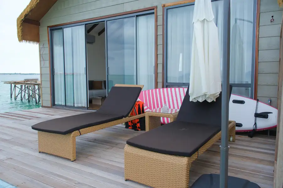 Private sun-drenched balcony with ocean views at Orange Wave Resort.
