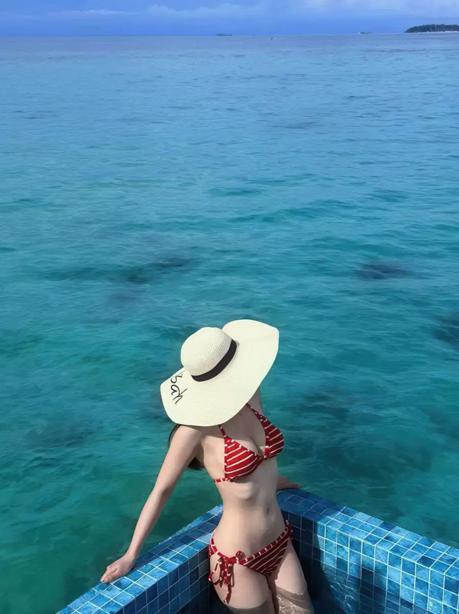 Guest standing at the corner in a private pool at Orange Wave Resort.